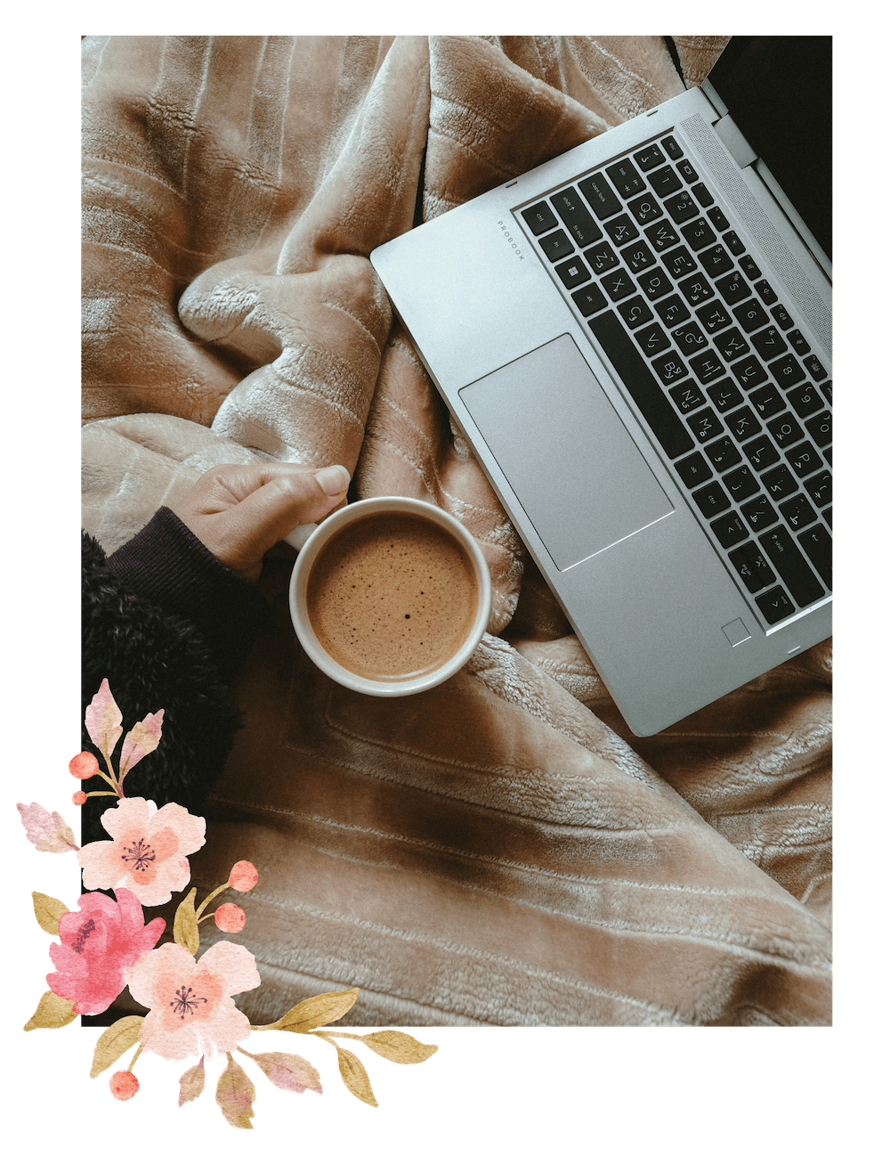 Open Laptop and coffee with floral detail