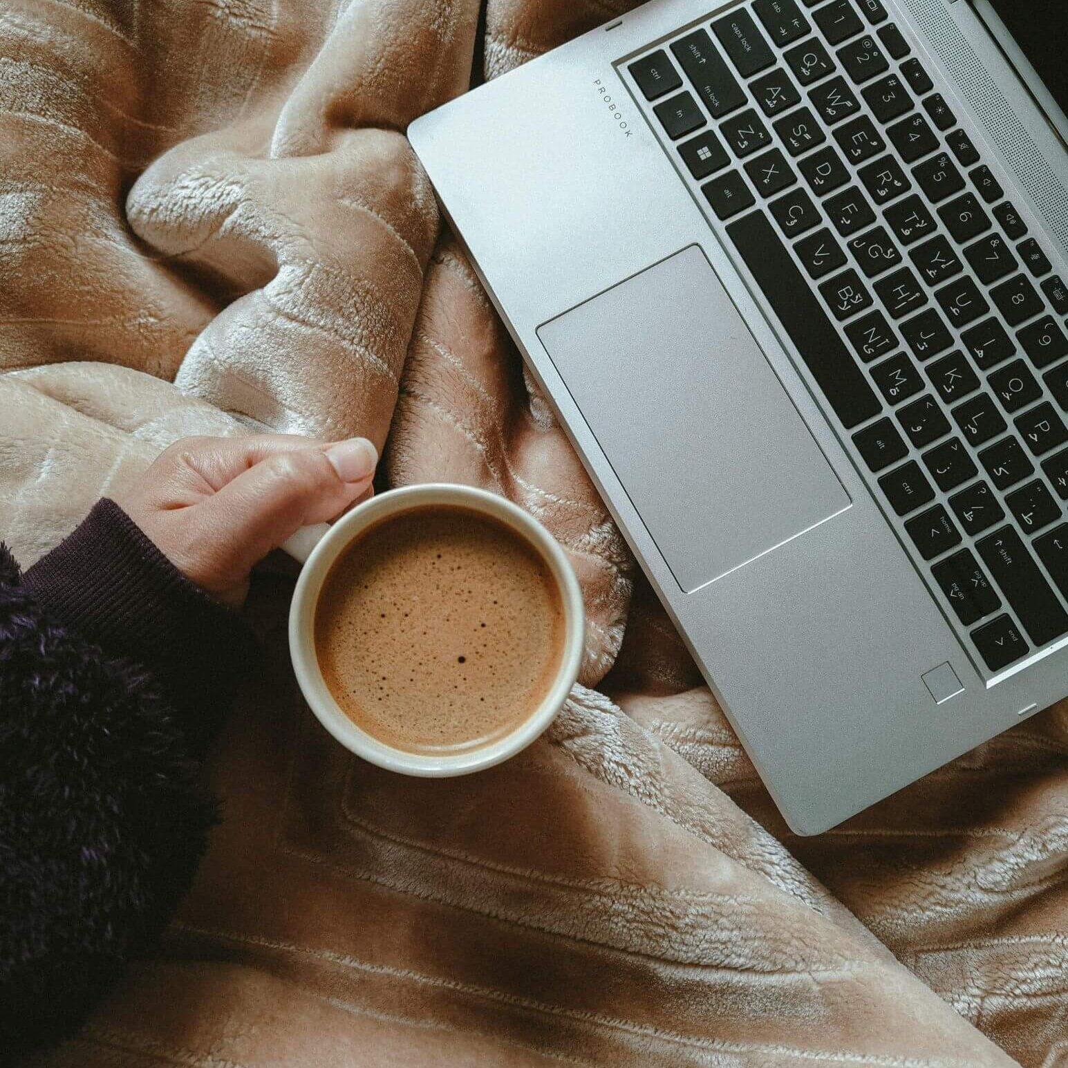 Laptop and Coffee in bed