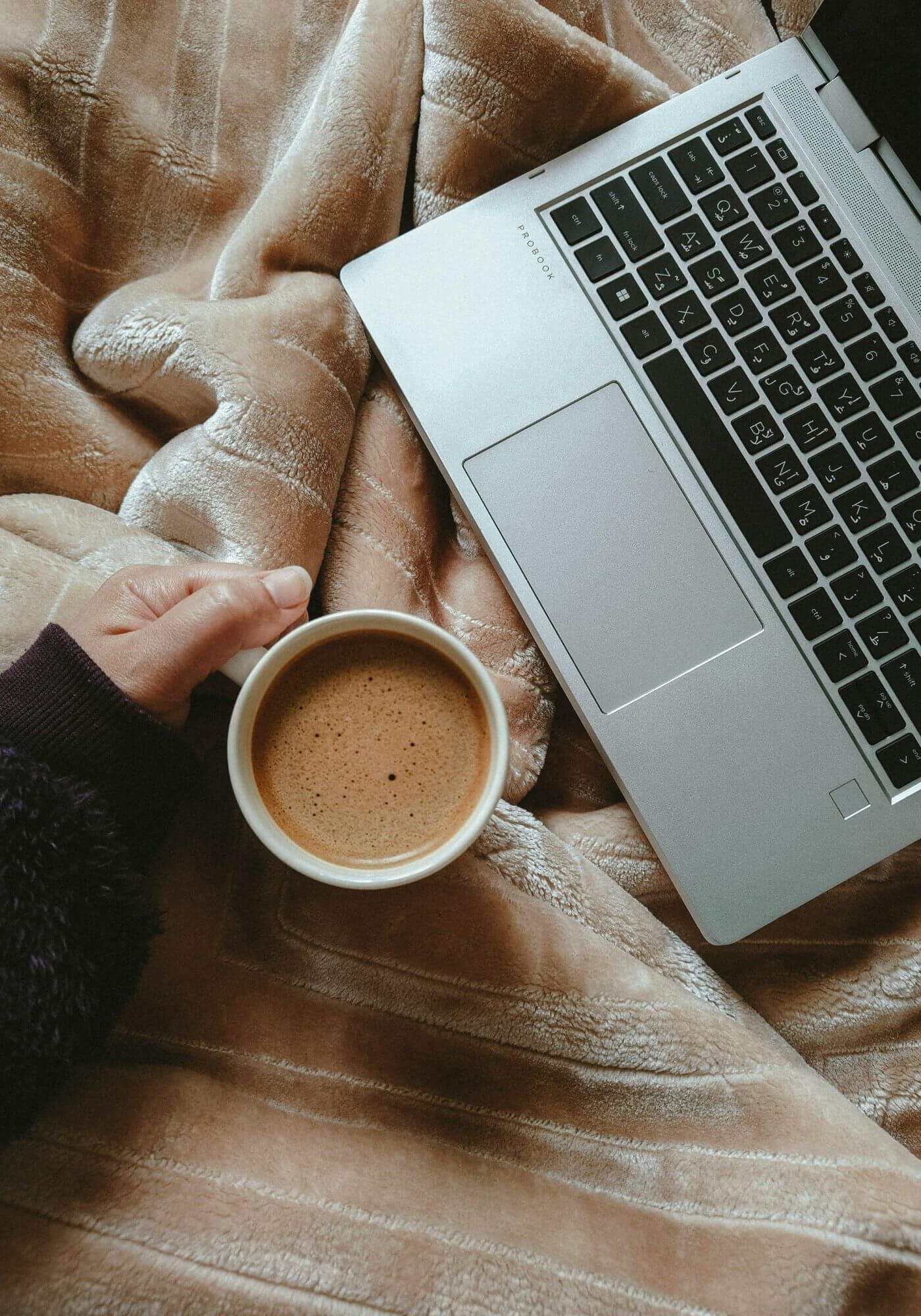 Laptop and Coffee in bed